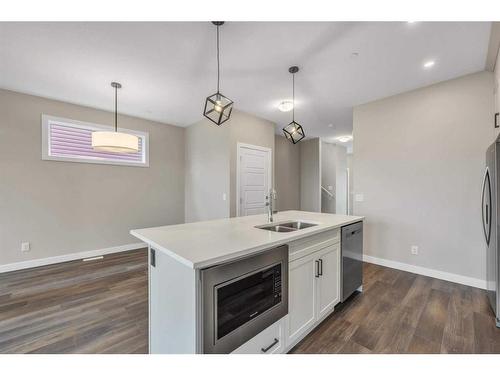 33 Hotchkiss Lane Se, Calgary, AB - Indoor Photo Showing Kitchen With Double Sink