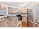 2321-8 Bridlecrest Drive Sw, Calgary, AB  - Indoor Photo Showing Kitchen With Double Sink 