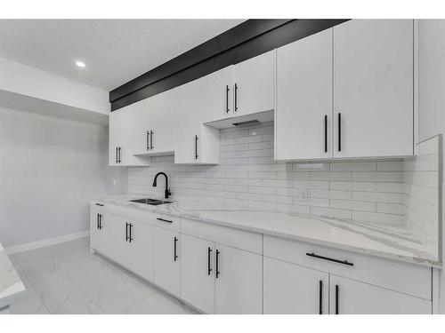 208 Waterford Heath, Chestermere, AB - Indoor Photo Showing Kitchen With Double Sink With Upgraded Kitchen