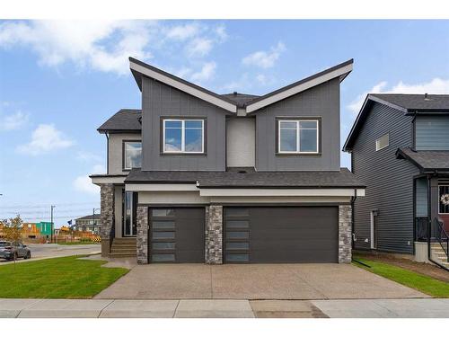 208 Waterford Heath, Chestermere, AB - Outdoor With Facade