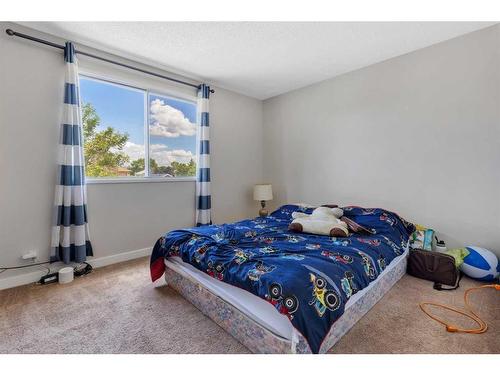 963 Erin Woods Drive Se, Calgary, AB - Indoor Photo Showing Bedroom