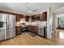 963 Erin Woods Drive Se, Calgary, AB  - Indoor Photo Showing Kitchen With Stainless Steel Kitchen With Double Sink 