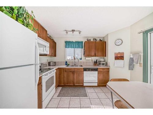 71 Taradale Drive Ne, Calgary, AB - Indoor Photo Showing Kitchen With Double Sink