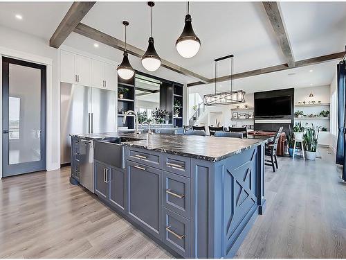 11 Chokecherry Ridge, Rural Rocky View County, AB - Indoor Photo Showing Kitchen With Upgraded Kitchen