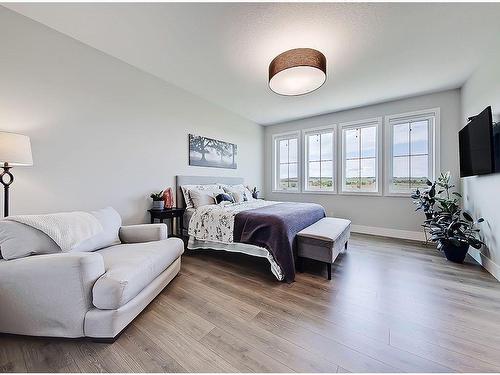 11 Chokecherry Ridge, Rural Rocky View County, AB - Indoor Photo Showing Bedroom