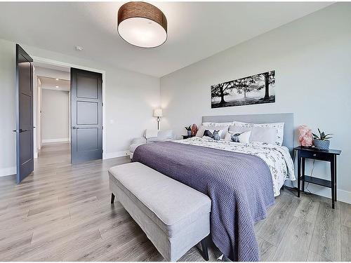 11 Chokecherry Ridge, Rural Rocky View County, AB - Indoor Photo Showing Bedroom