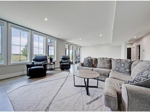 11 Chokecherry Ridge, Rural Rocky View County, AB - Indoor Photo Showing Living Room