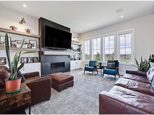 11 Chokecherry Ridge, Rural Rocky View County, AB - Indoor Photo Showing Living Room With Fireplace