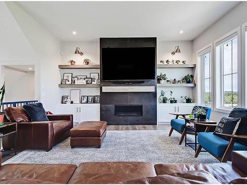 11 Chokecherry Ridge, Rural Rocky View County, AB - Indoor Photo Showing Living Room With Fireplace