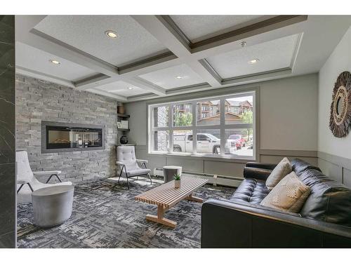 1309-450 Kincora Glen Road Nw, Calgary, AB - Indoor Photo Showing Living Room With Fireplace