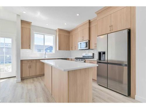 135 Amblefield Avenue Nw, Calgary, AB - Indoor Photo Showing Kitchen With Upgraded Kitchen