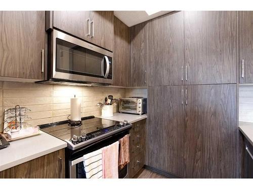 302-38 Quarry Gate Se, Calgary, AB - Indoor Photo Showing Kitchen