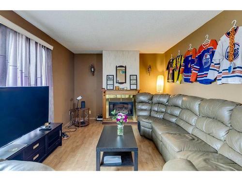 7916 47 Avenue Nw, Calgary, AB - Indoor Photo Showing Living Room With Fireplace