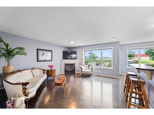 192 Copperfield Common Se, Calgary, AB - Indoor Photo Showing Living Room With Fireplace