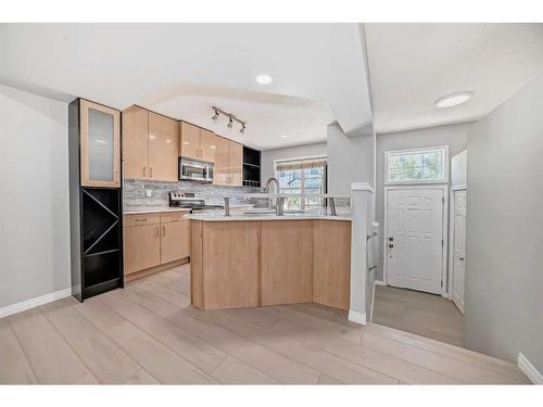 3074 New Brighton Gardens Se, Calgary, AB - Indoor Photo Showing Kitchen With Double Sink