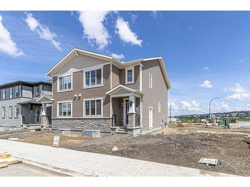 127 Carringford Road Nw, Calgary, AB - Outdoor With Facade