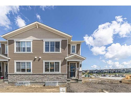 127 Carringford Road Nw, Calgary, AB - Outdoor With Facade