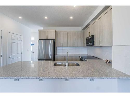 127 Carringford Road Nw, Calgary, AB - Indoor Photo Showing Kitchen With Double Sink With Upgraded Kitchen
