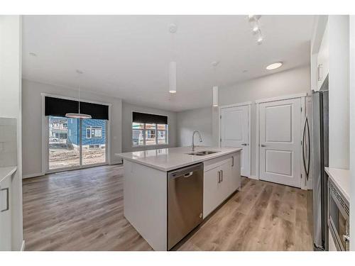 184 Hotchkiss Way Se, Calgary, AB - Indoor Photo Showing Kitchen With Double Sink