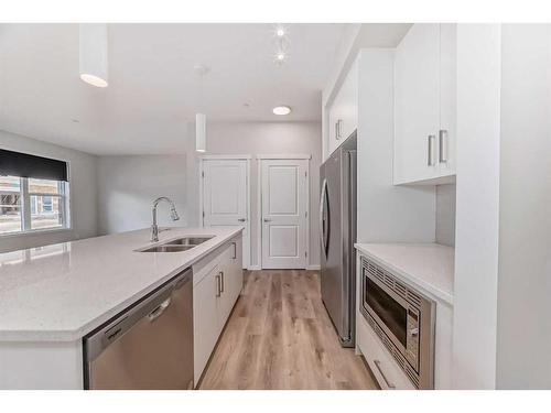 184 Hotchkiss Way Se, Calgary, AB - Indoor Photo Showing Kitchen With Double Sink