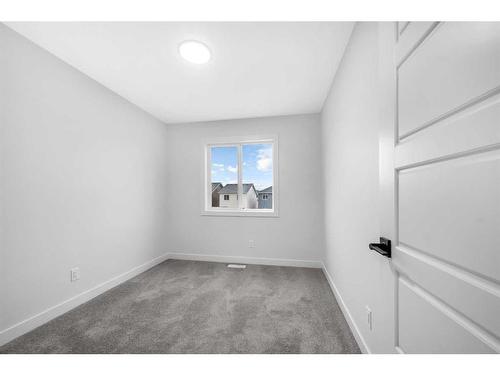 21 Amblefield Passage Nw, Calgary, AB - Indoor Photo Showing Kitchen With Double Sink