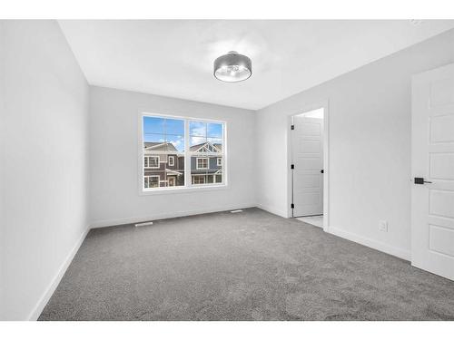 21 Amblefield Passage Nw, Calgary, AB - Indoor Photo Showing Kitchen With Upgraded Kitchen