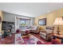 49 Richelieu Court Sw, Calgary, AB  - Indoor Photo Showing Living Room 