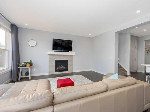 452 Evansglen Drive Nw, Calgary, AB - Indoor Photo Showing Living Room With Fireplace