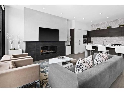 3-408 13 Street Nw, Calgary, AB - Indoor Photo Showing Living Room With Fireplace
