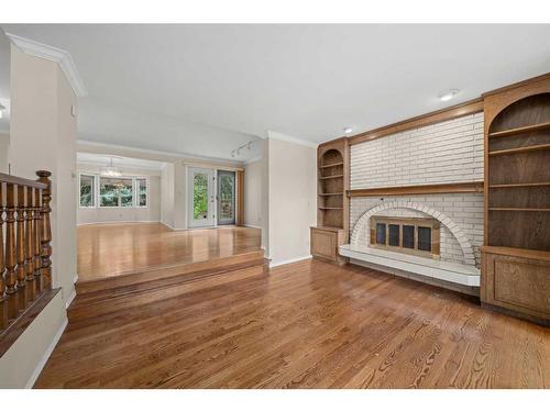 3339 Palliser Drive Sw, Calgary, AB - Indoor Photo Showing Other Room With Fireplace