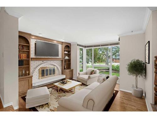 3339 Palliser Drive Sw, Calgary, AB - Indoor Photo Showing Living Room With Fireplace