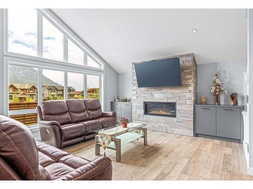 494 Stewart Creek Close, Canmore, AB - Indoor Photo Showing Living Room With Fireplace