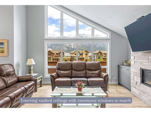 494 Stewart Creek Close, Canmore, AB - Indoor Photo Showing Living Room With Fireplace