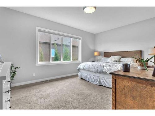 327 Shawnee Boulevard Sw, Calgary, AB - Indoor Photo Showing Bedroom