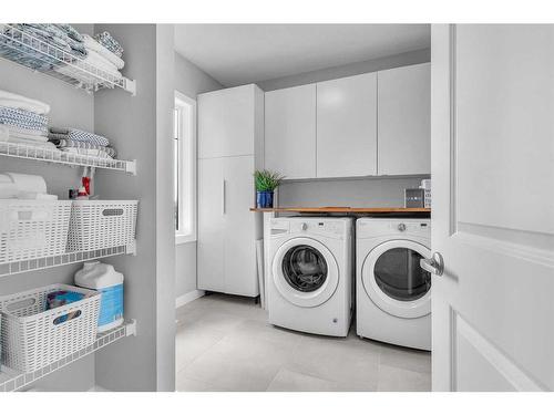 327 Shawnee Boulevard Sw, Calgary, AB - Indoor Photo Showing Laundry Room