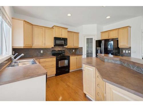 39 Prestwick Parade Se, Calgary, AB - Indoor Photo Showing Kitchen With Double Sink