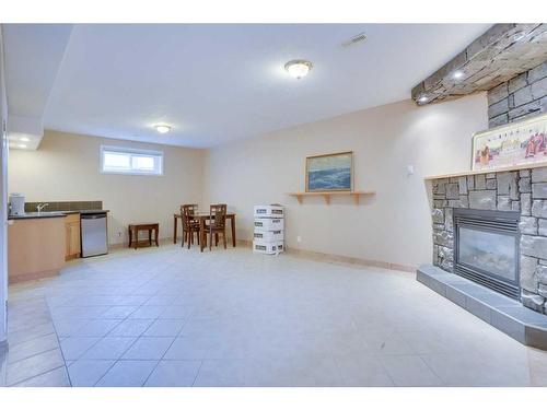 121 Taracove Place Ne, Calgary, AB - Indoor Photo Showing Other Room With Fireplace