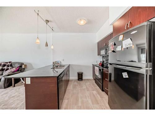 1411-8880 Horton Road Sw, Calgary, AB - Indoor Photo Showing Kitchen With Double Sink With Upgraded Kitchen