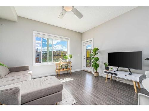 215-8 Sage Hill Terrace Nw, Calgary, AB - Indoor Photo Showing Living Room