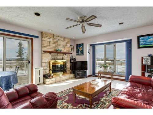 33022 Township Road 250, Rural Rocky View County, AB - Indoor Photo Showing Living Room With Fireplace