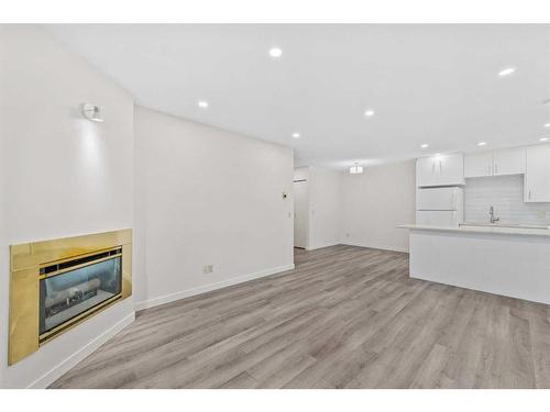 3224-3224 Edenwold Heights Nw, Calgary, AB - Indoor With Fireplace