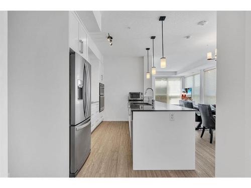 109-2231 Mahogany Boulevard Se, Calgary, AB - Indoor Photo Showing Kitchen With Upgraded Kitchen