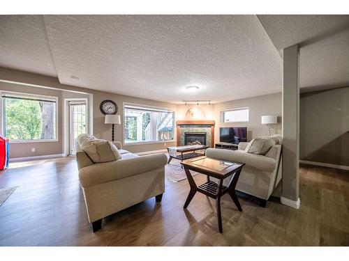 86 Mt Kidd Gardens Se, Calgary, AB - Indoor Photo Showing Living Room With Fireplace