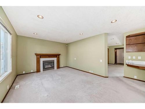 7221 California Boulevard Ne, Calgary, AB - Indoor Photo Showing Other Room With Fireplace