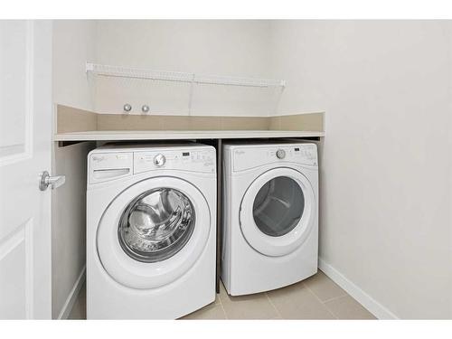 306 Carringvue Manor Nw, Calgary, AB - Indoor Photo Showing Laundry Room