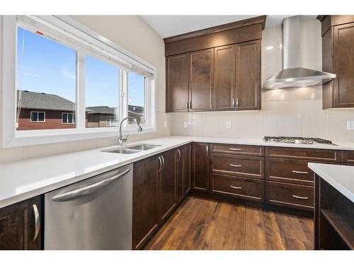 306 Carringvue Manor Nw, Calgary, AB - Indoor Photo Showing Kitchen With Double Sink