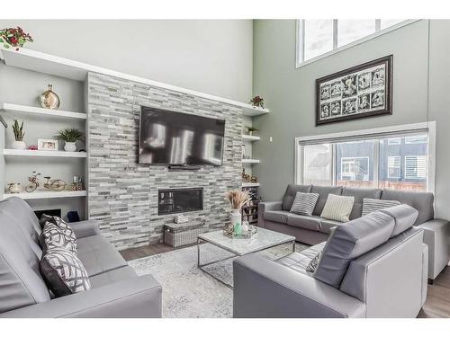 116 Sandpiper Landing, Chestermere, AB - Indoor Photo Showing Living Room With Fireplace