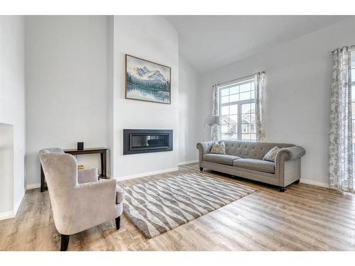 25 Yorkstone Way Sw, Calgary, AB - Indoor Photo Showing Living Room With Fireplace