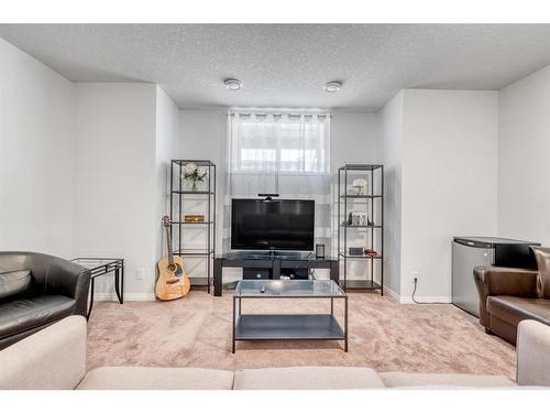 25 Yorkstone Way Sw, Calgary, AB - Indoor Photo Showing Living Room