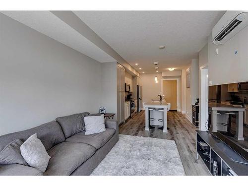 107-1702 17 Avenue Sw, Calgary, AB - Indoor Photo Showing Living Room